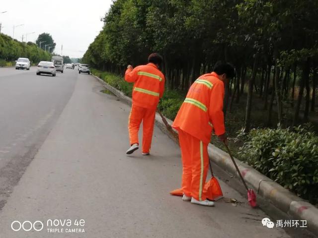 禹州环卫雨后忙清洁 城市依然美 禹州环卫雨后忙清洁 城市依然美
