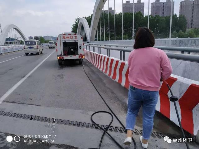 禹州环卫雨后忙清洁 城市依然美 禹州环卫雨后忙清洁 城市依然美
