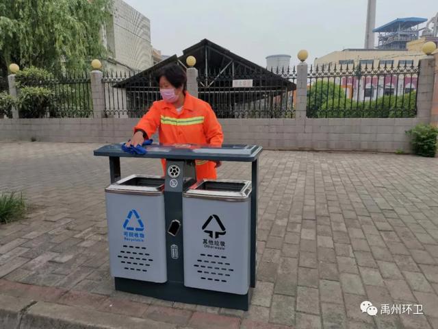 禹州环卫雨后忙清洁 城市依然美 禹州环卫雨后忙清洁 城市依然美