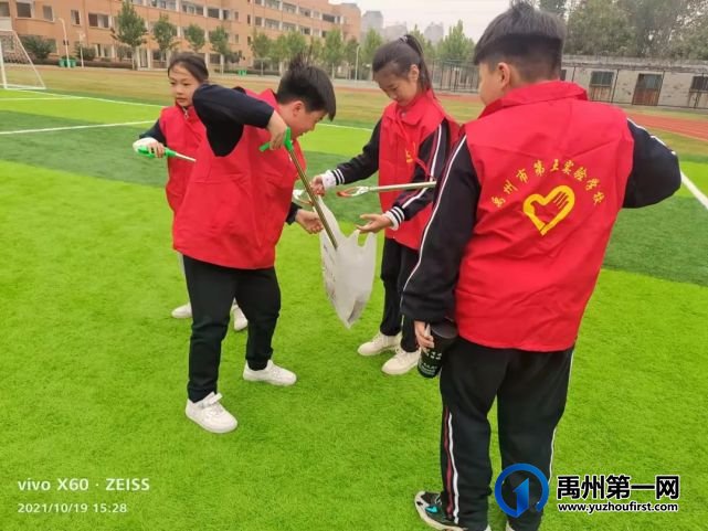 禹州市第五实验学校:文明伴校园 我们在行动 禹州市第五实验学校:文明伴校园 我们在行动