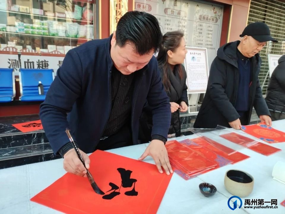 秦九堂携手中原传统书画院开展春节送春联活动 秦九堂携手中原传统书画院开展春节送春联活动